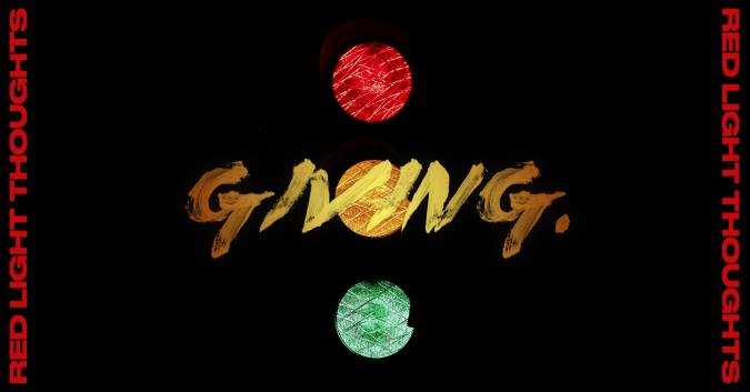 black image with a traffic light that says "red light thoughts: GIVING"
